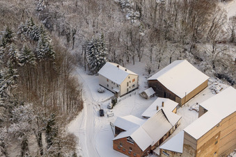 Aerial photograpy of Hardtmühle in winter with snow in Kandel in the state Rhineland-Palatinate, Germany