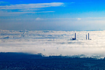 Chimneys of the ENBW steam power plant in the fog in the district Daxlanden in Karlsruhe in the state Baden-Wuerttemberg, Germany