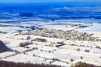 Village view from the southeast in snow in winter in Minfeld in the state Rhineland-Palatinate, Germany