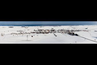 Wintry snowy Panoramic perspective Village - view on the edge of agricultural fields and farmland in Oberlauterbach in Grand Est, France