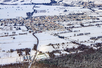 Village view from the south in snow in winter in Steinfeld in the state Rhineland-Palatinate, Germany