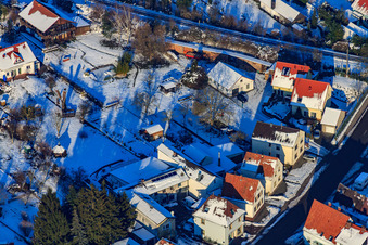 Saarstraße in snow in winter in Kandel in the state Rhineland-Palatinate, Germany