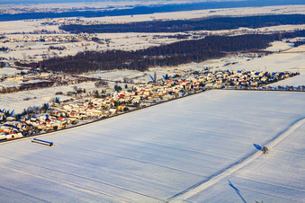 Village view from the southwest in snow in winter in the district Minderslachen in Kandel in the state Rhineland-Palatinate, Germany