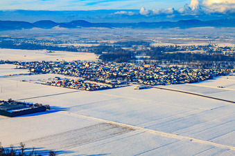 Village view from the southeast in snow in winter in Steinweiler in the state Rhineland-Palatinate, Germany