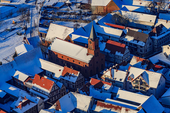 Aerial view of Protest. Church in the snow in winter in Steinweiler in the state Rhineland-Palatinate, Germany