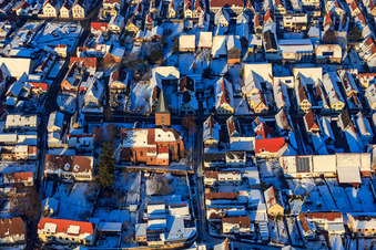 Aerial photograpy of Protest. Church in the snow in winter in Steinweiler in the state Rhineland-Palatinate, Germany