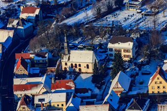 Protest. Church in the snow in winter in Impflingen in the state Rhineland-Palatinate, Germany