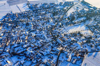 Village view from the north in snow in winter in the district Mörzheim in Landau in der Pfalz in the state Rhineland-Palatinate, Germany