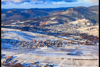 Aerial view of Wine-growing village under the Keschdebusch vineyard in winter with snow in Birkweiler in the state Rhineland-Palatinate, Germany