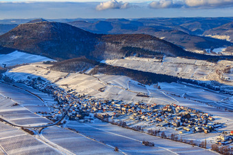 Wine-growing village under the Keschdebusch vineyard in winter with snow in Ranschbach in the state Rhineland-Palatinate, Germany