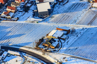 Aerial view of Gies-Düppel Winery in winter with snow in Birkweiler in the state Rhineland-Palatinate, Germany