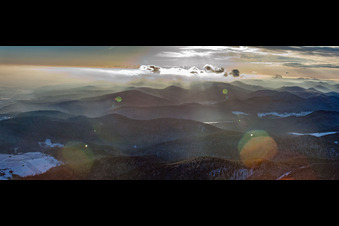 Panorama of the mountains of the Palatinate Forest from the northeast in snow in winter in Bad Bergzabern in the state Rhineland-Palatinate, Germany