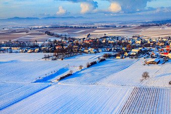 Village view in snow in winter from the southeast in Dierbach in the state Rhineland-Palatinate, Germany
