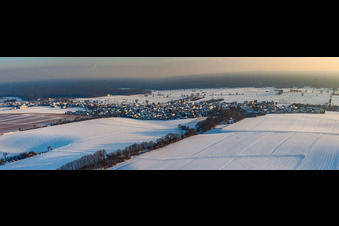 Village view in snow in winter from the northwest in Freckenfeld in the state Rhineland-Palatinate, Germany
