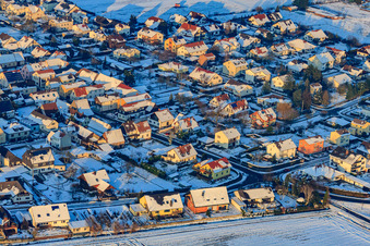 Holzgasse in the evening light with snow in winter in Minfeld in the state Rhineland-Palatinate, Germany