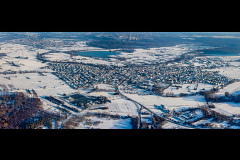 Panorama of the city view in snow in winter from the west in Hagenbach in the state Rhineland-Palatinate, Germany