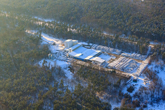 Aerial view of Kalksandsteinwerke Schencking GmbH & Co. KG, Bienwald plant in snow in winter in Berg in the state Rhineland-Palatinate, Germany