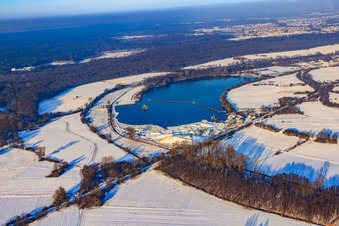 Aerial view of Epple Baggersee in snow in winter in Neuburg am Rhein in the state Rhineland-Palatinate, Germany