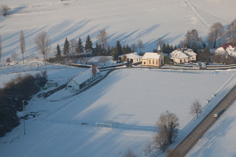 Football club with its own chapel in winter when there is snow in Neewiller-près-Lauterbourg in the state Bas-Rhin, France