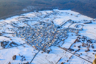 Village view in forest clearing in snow in winter from the southeast in the district Büchelberg in Wörth am Rhein in the state Rhineland-Palatinate, Germany