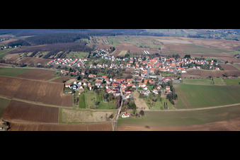 Village - view on the edge of agricultural fields and farmland in Kutzenhausen in Grand Est, France