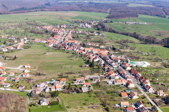 Village - view on the edge of agricultural fields and farmland in Weislingen in Grand Est, France