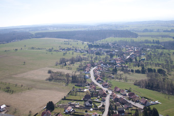 Aerial view of Village - view on the edge of agricultural fields and farmland in Struth in Grand Est, France