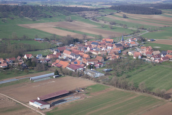 Village - view on the edge of agricultural fields and farmland in Geiswiller in Grand Est, France