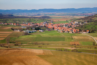 Aerial view of Village - view on the edge of agricultural fields and farmland in Kirrwiller in Grand Est, France