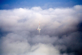 Wind turbines in clouds in Minfeld in the state Rhineland-Palatinate, Germany