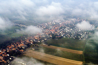 Place under low clouds in Freckenfeld in the state Rhineland-Palatinate, Germany