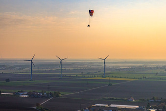 Paraglider over the wind farm Minfeld in Minfeld in the state Rhineland-Palatinate, Germany