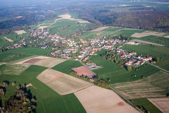 Village - view on the edge of agricultural fields and farmland in Kroeppen in the state Rhineland-Palatinate, Germany