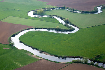 Aerial view of Curved loop of the riparian zones on the course of the river La Chiers in Carignan in Alsace-Champagne-Ardenne-Lorraine, France