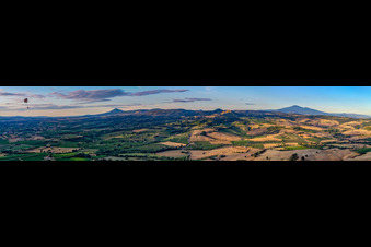 Panoramic perspective of Rocky and mountainous landscape with Paraglider in Montepulciano in Toskana, Italy