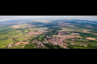 Panoramic perspective Village - view on the edge of agricultural fields and farmland in Billigheim-Ingenheim in the state Rhineland-Palatinate, Germany
