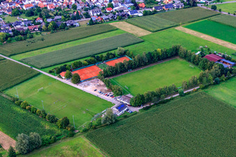 Oblique view of Sports fields of the SV 1946 Minfeld football club and the TC Minfeld in Minfeld in the state Rhineland-Palatinate, Germany