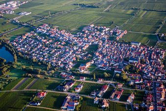 Village - view on the edge of agricultural fields and farmland in Kirrweiler (Pfalz) in the state Rhineland-Palatinate, Germany seen from above