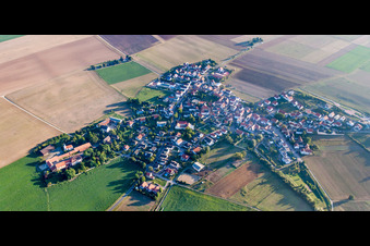 Village - view on the edge of agricultural fields and farmland in Quirnheim in the state Rhineland-Palatinate, Germany