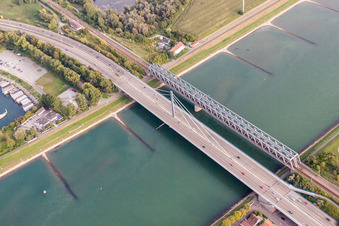Rail and Street bridges construction across the Rhine river between Karlsruhe and Woerth am Rhein in the state Rhineland-Palatinate, Germany from above