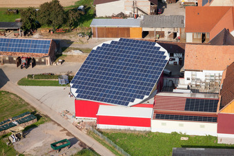 Panel rows of photovoltaic turnable roof of a stable in the district Deutschhof in Kapellen-Drusweiler in the state Rhineland-Palatinate from above