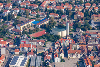 School building of the Theodor-Heuss-School and of a church in Sinsheim in the state Baden-Wurttemberg, Germany