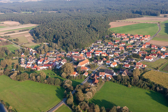Village - view on the edge of agricultural fields and farmland in Schluesselau in the state Bavaria, Germany