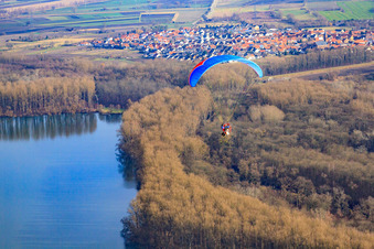 Paraglider over the Saalbach Canal in the district Rußheim in Dettenheim in the state Baden-Wuerttemberg, Germany