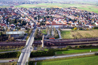 Pedestrian crossing and train station from the east in Neulußheim in the state Baden-Wuerttemberg, Germany