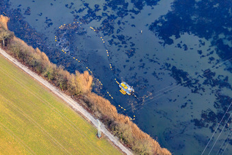 Boat for Old Rhine desilting in Wörth am Rhein in the state Rhineland-Palatinate, Germany