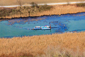 Boat for Old Rhine desilting in Neupotz in the state Rhineland-Palatinate, Germany