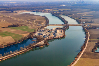 Aerial view of Polder dam through the quarry lake in Neupotz in the state Rhineland-Palatinate, Germany