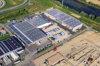 Oblique view of Halls and trucks of the NUSS Group in the Oberwald industrial area in Wörth am Rhein in the state Rhineland-Palatinate, Germany