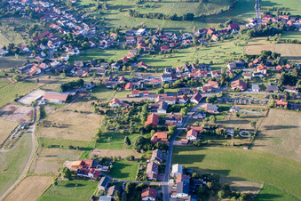 Oblique view of Village - view on the edge of agricultural fields and farmland in Wuerzberg in the state Hesse, Germany